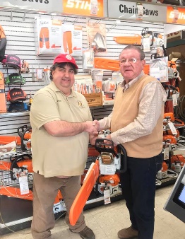 Gary Gallloway shaking hands with the President of SJQP